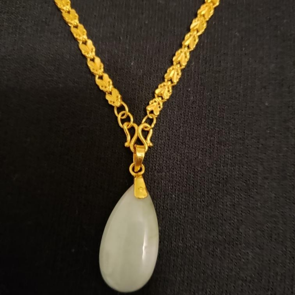 24-karat gold necklace with Jade earrings and J me